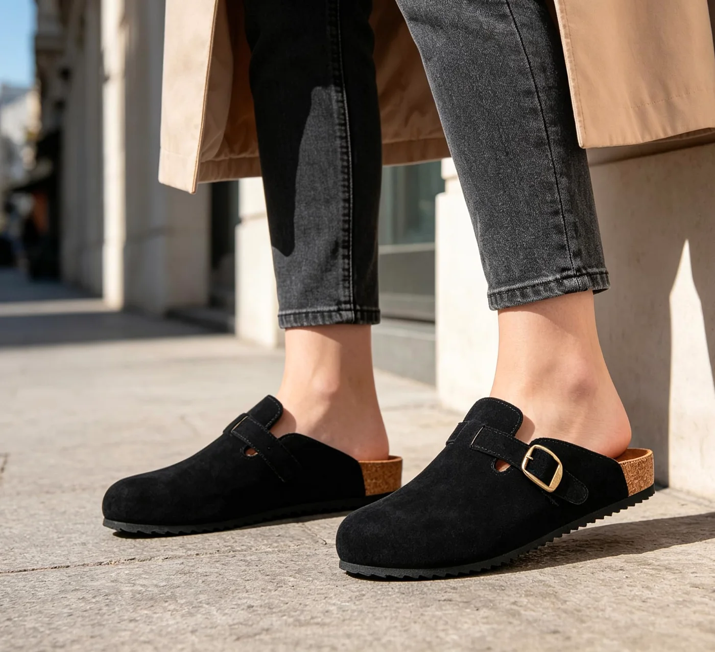 Intini suede cork clog in black, worn on a city sidewalk
